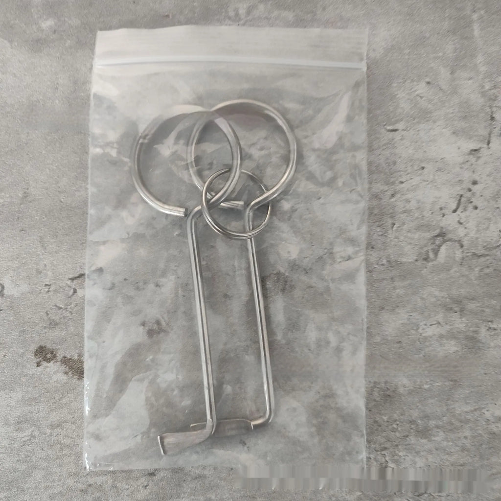 Two silver alloy wrench tools from a portable universal tool set.