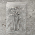 Two silver alloy wrench tools from a portable universal tool set.