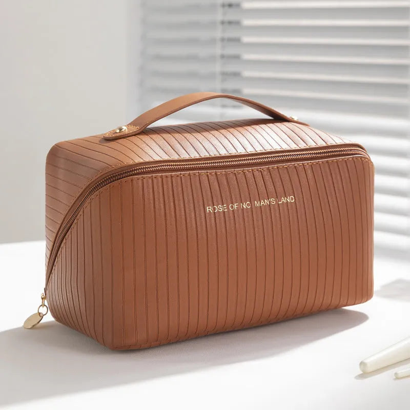 Cubic PU makeup bag with vertical pattern pillow design measuring 22.5cm