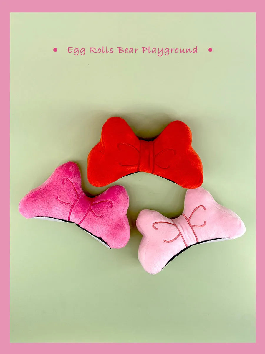 Soft plush velvet bow tie decoration for motorcycle and ski helmets with elastic strap.