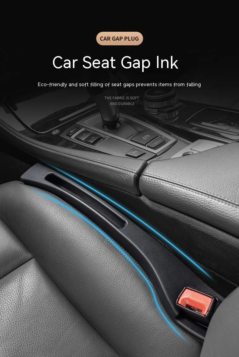 Black plastic car seat gap storage box with removal handle inserted between vehicle seats
