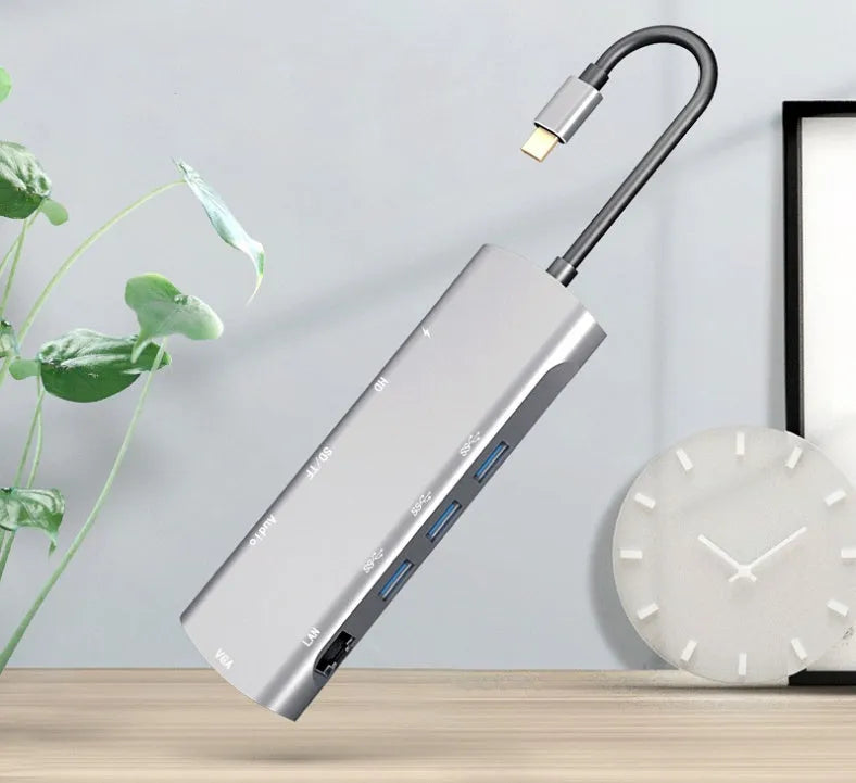 Grey aluminium alloy USBC docking station with HDMI, VGA, and USB ports