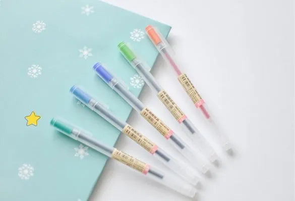 Pack of 12 black Muji gel pens with 0.5mm fine nibs on a white background