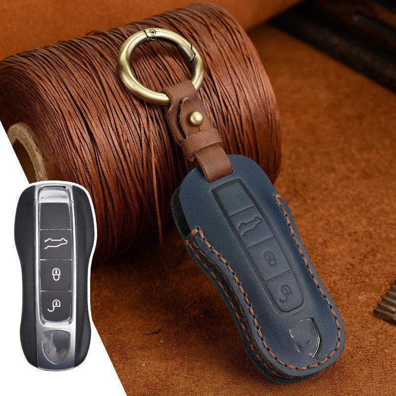 Authentic cowhide leather Porsche key cover with retro buckle closure in blue colour