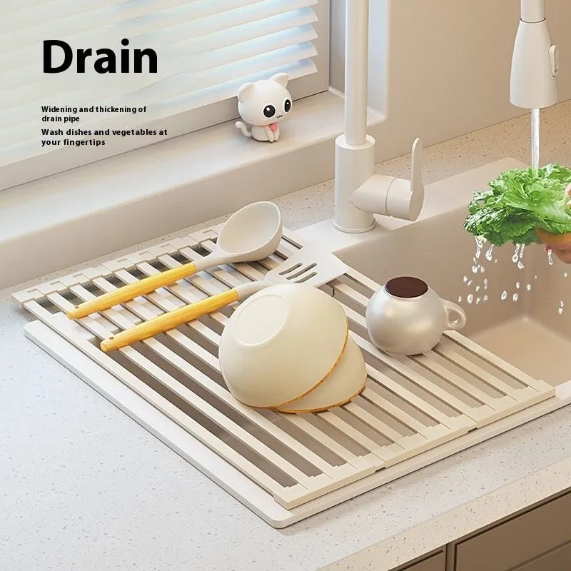 Foldable milky white stainless steel kitchen draining rack shown extended over a sink.