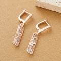 Rectangular two-tone hollow stud earrings with geometric design and silver electroplated finish