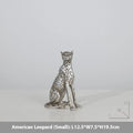 Modern resin leopard ornament in American Leopard colour on a shelf.