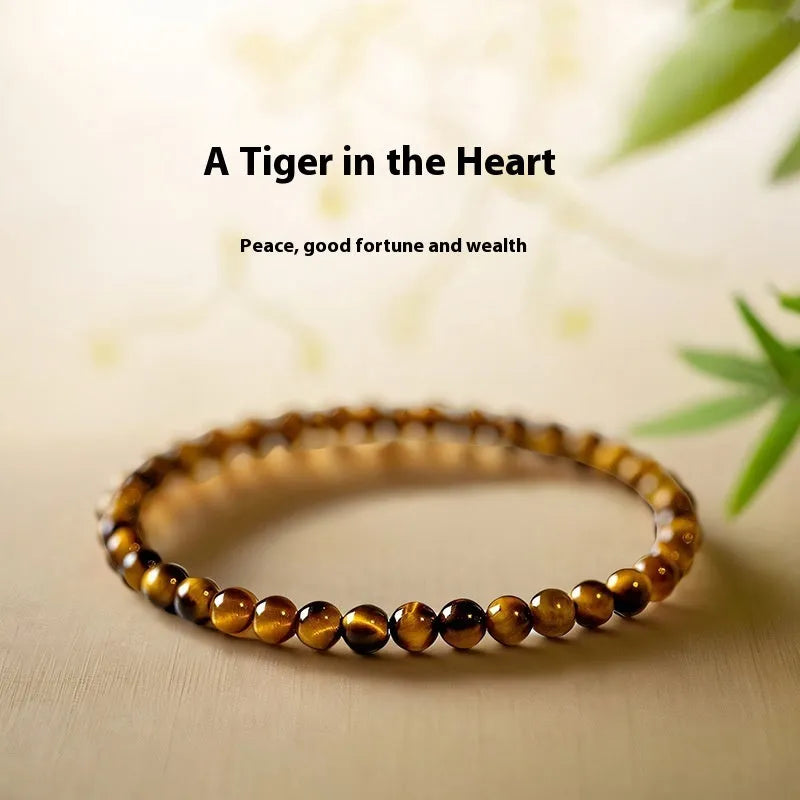 Tigereye stone bracelet with geometric Chinese style design showing round bead elements
