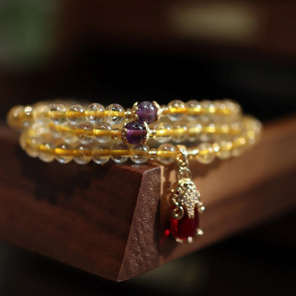 Natural Brazil gold rutilated quartz bracelet with three ring gold design and Chinese style manual crafted beads