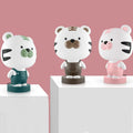 Cartoon animal table lamp in bear, cow, rabbit, or tiger design with plastic shade and LED light.