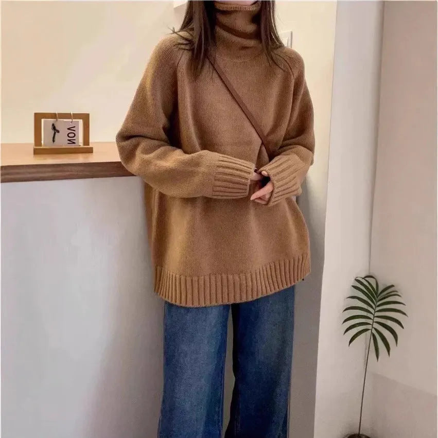 Women's thick turtleneck sweater in solid color with loose casual fit and curled pile collar detail, available in red, camel, gray, and black