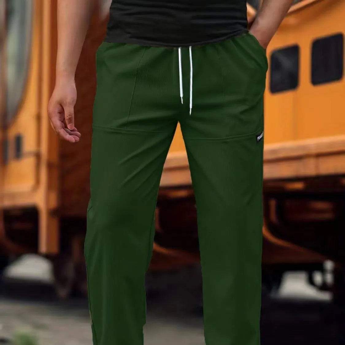 Men's polyester trousers for spring and autumn in light grey, shown in size M.