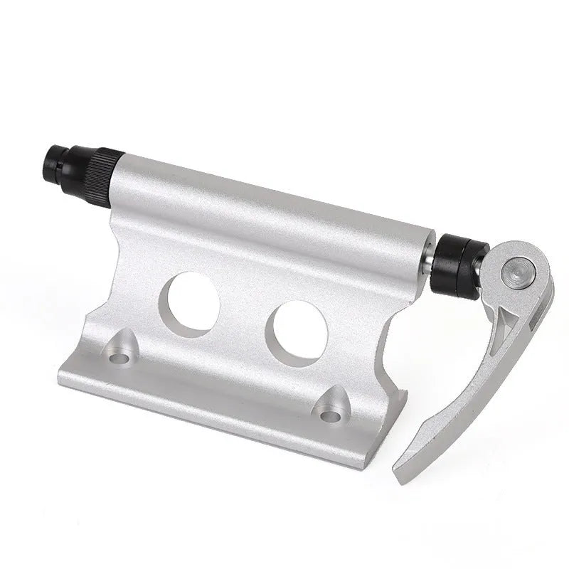 Silver metal quick release bicycle clamp for front fork accessory mounting.