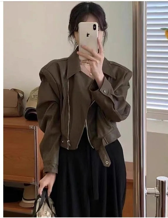 Women's slim fit leather coat jacket in black with long sleeves and pockets