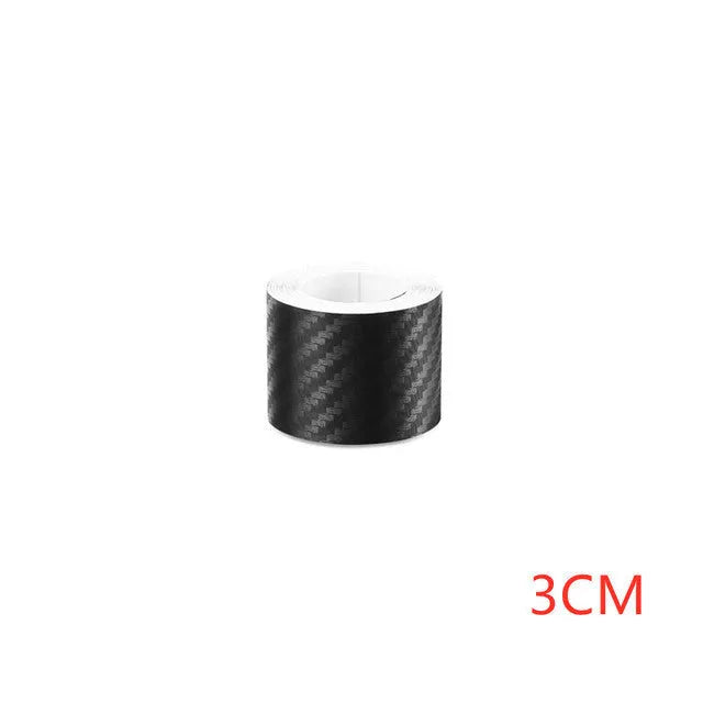 Matte black 3D carbon fibre roll for car door sill and bumper protection, showing texture and width options.