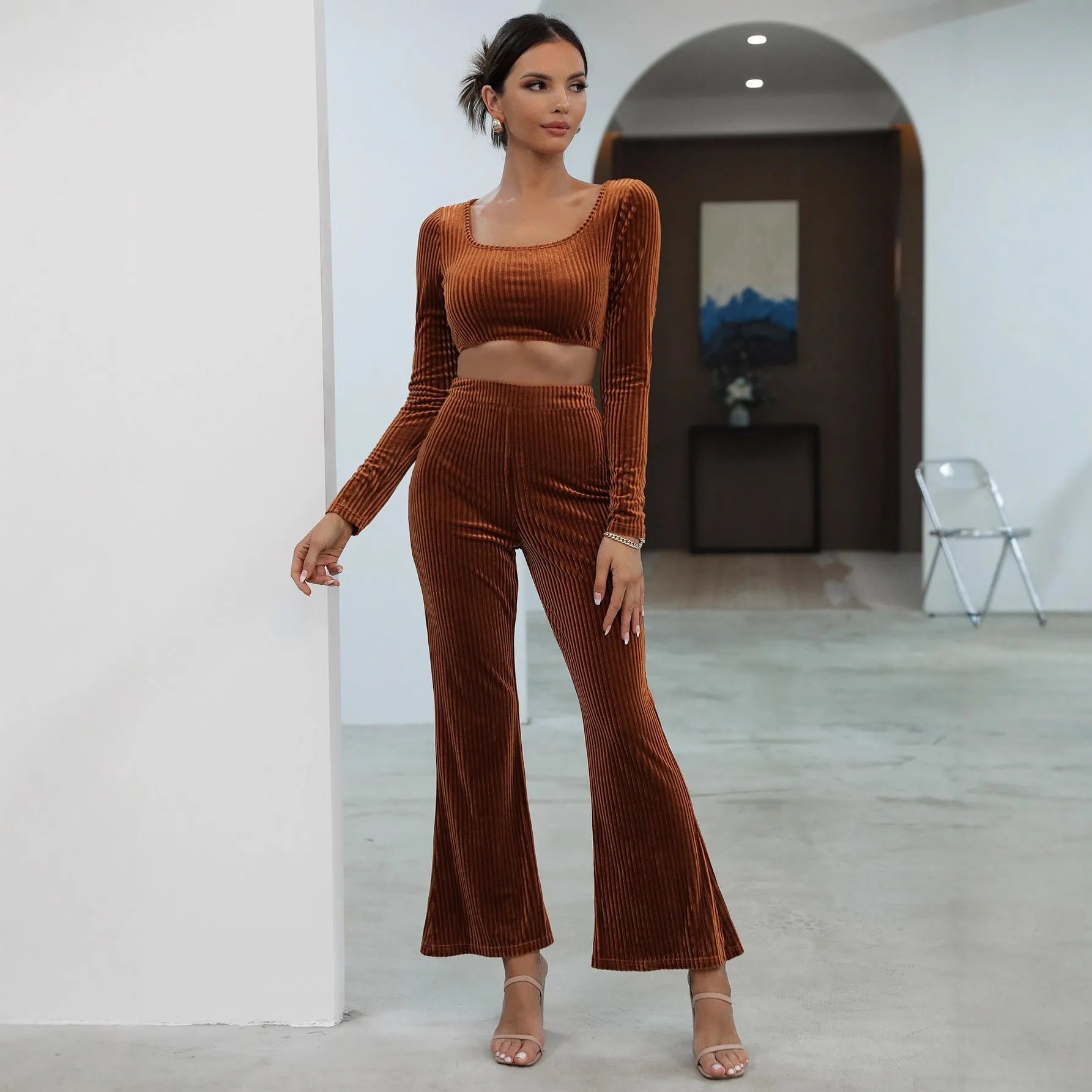 Caramel coloured long sleeve sweater set with matching trousers on hanger