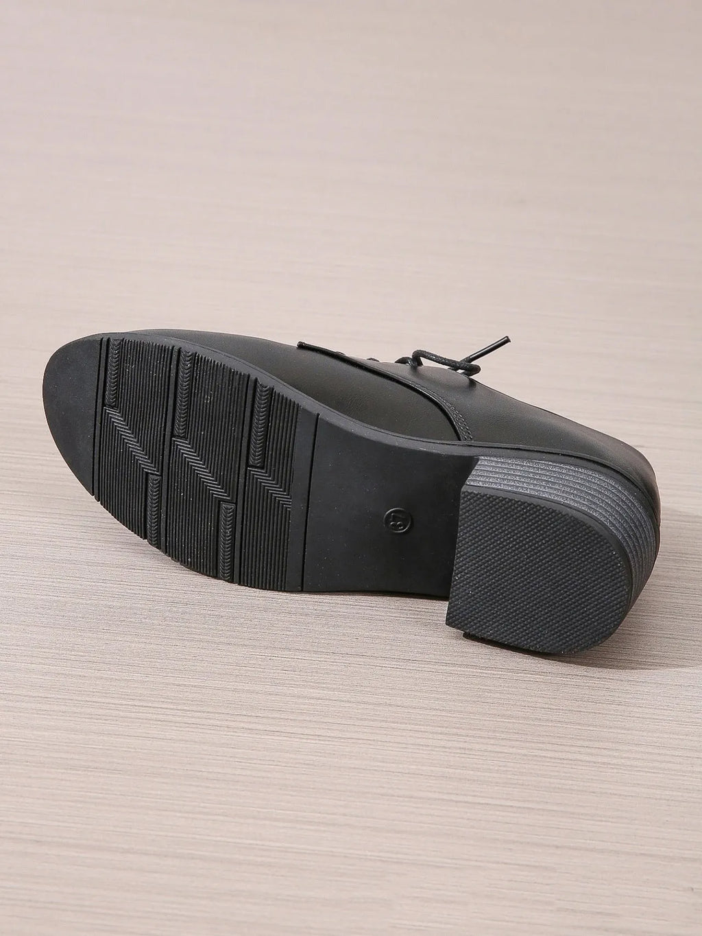 Black women's low-top work shoes with a thick chunky heel and rounded toe.