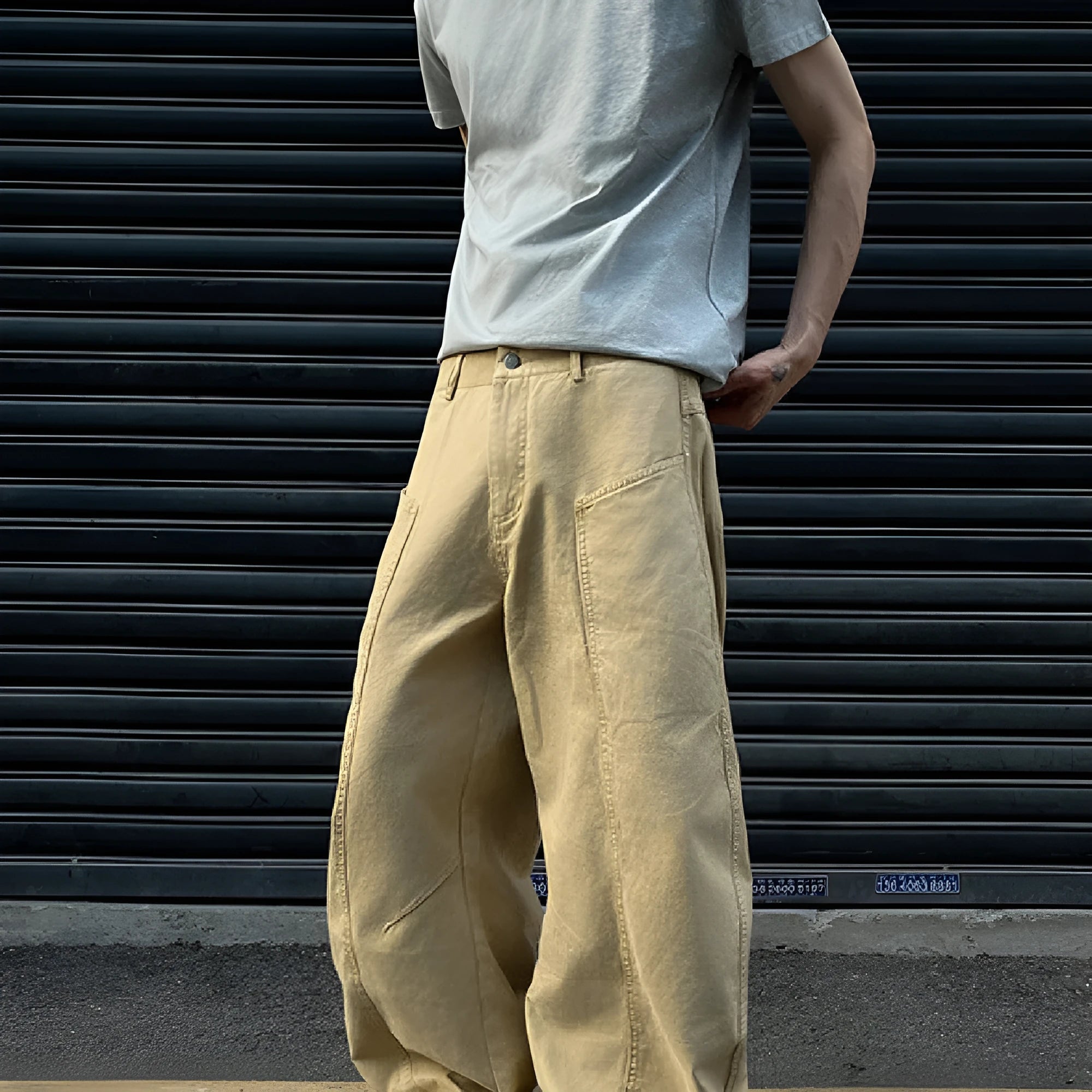 Men's straight leg khaki cotton trousers on a hanger, showing classic casual style.