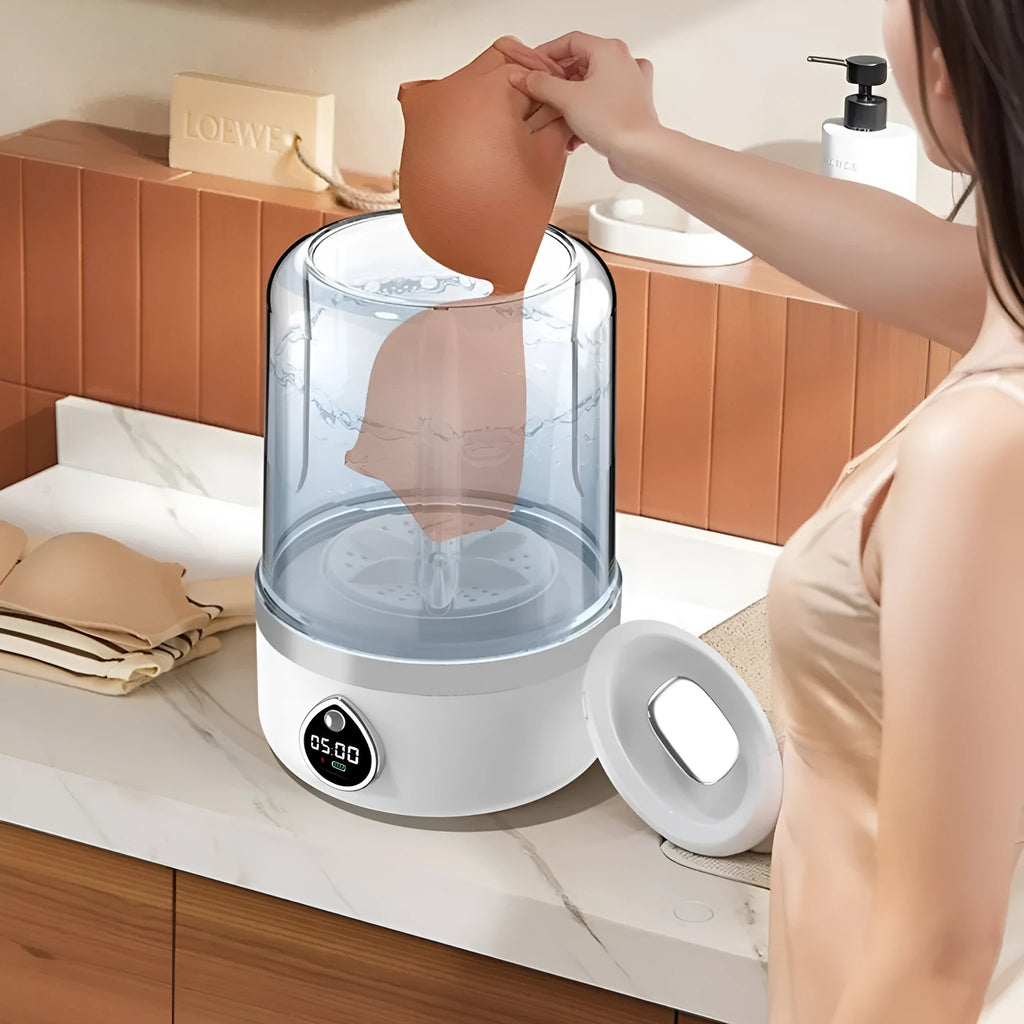 White portable USB charging mini washing machine on a countertop
