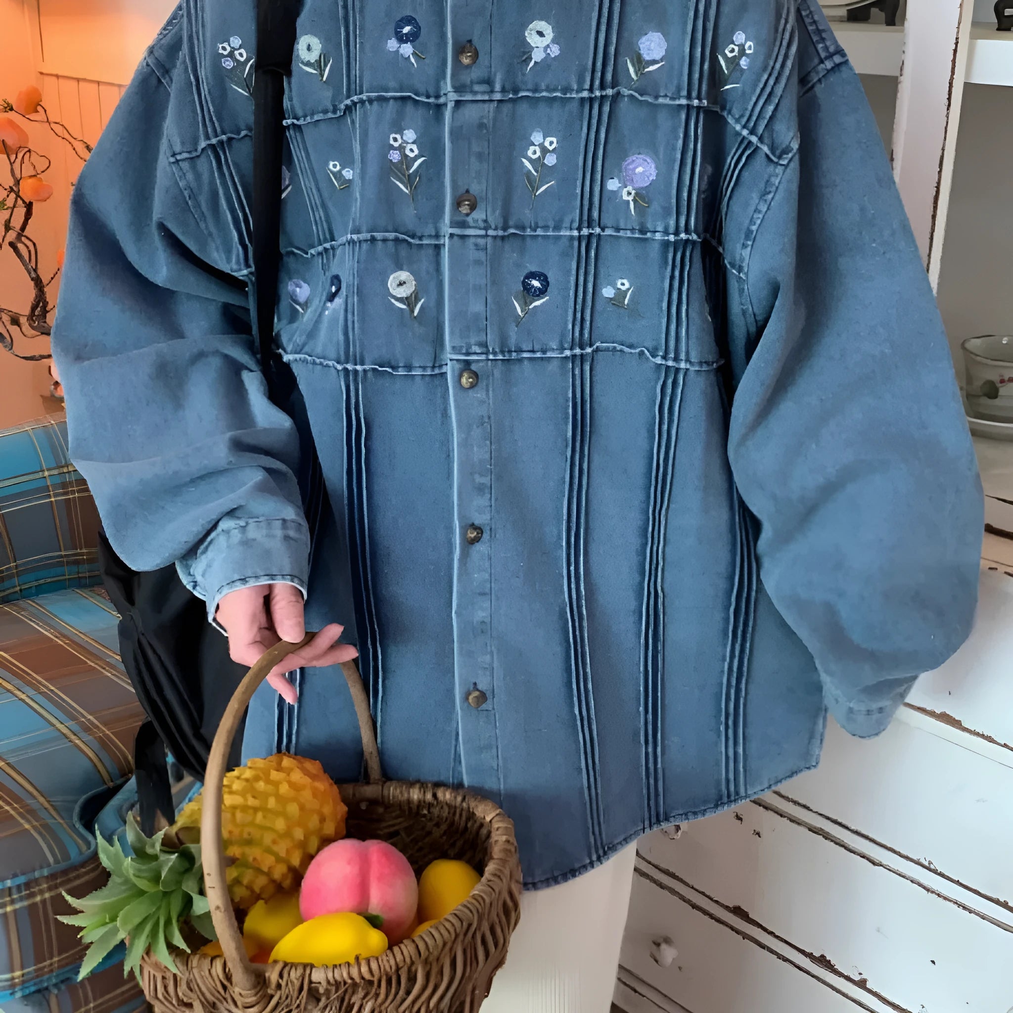 Vintage washed blue denim shirt with small floral embroidery and pleated front panel