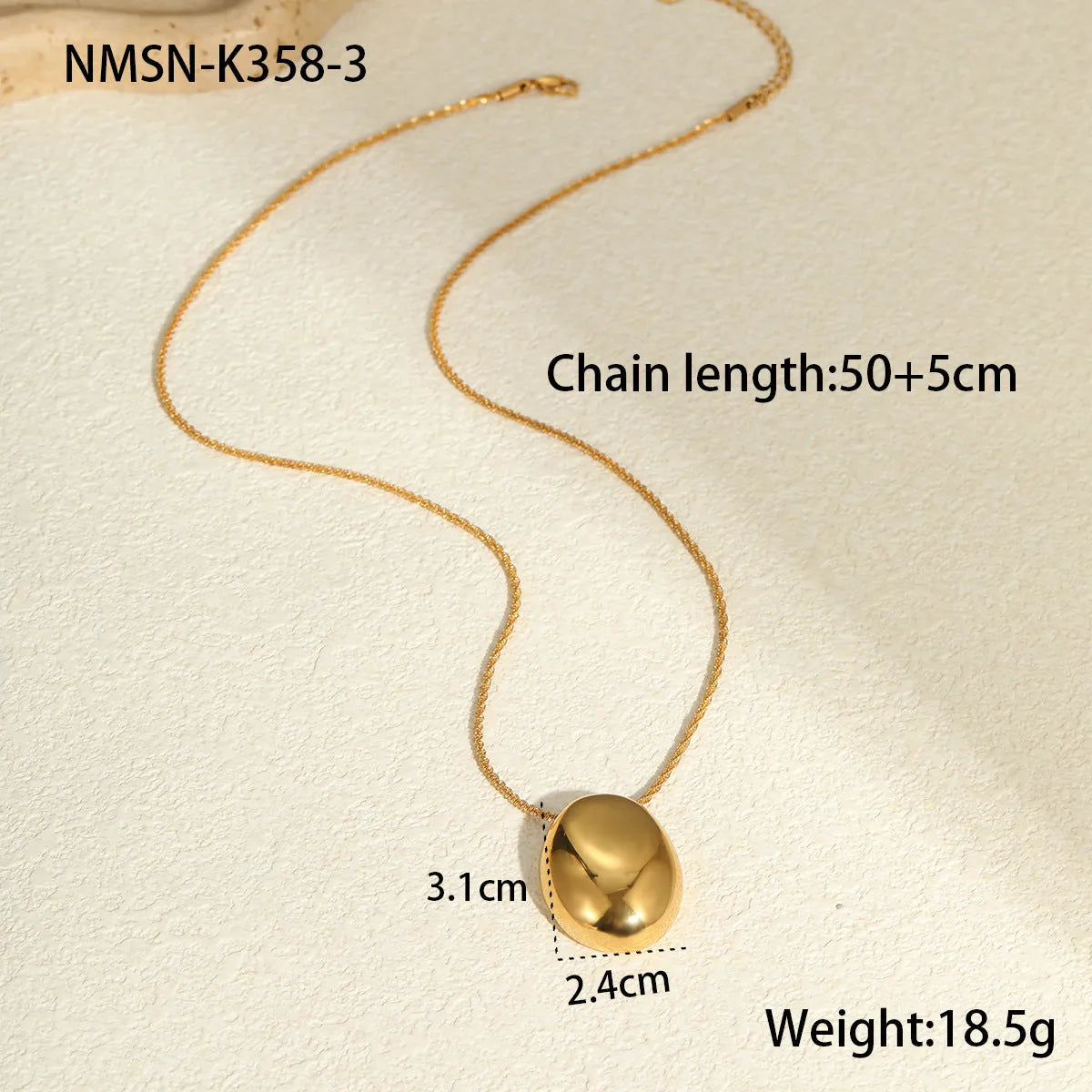 Gold geometric pendant necklace with adjustable chain on white background