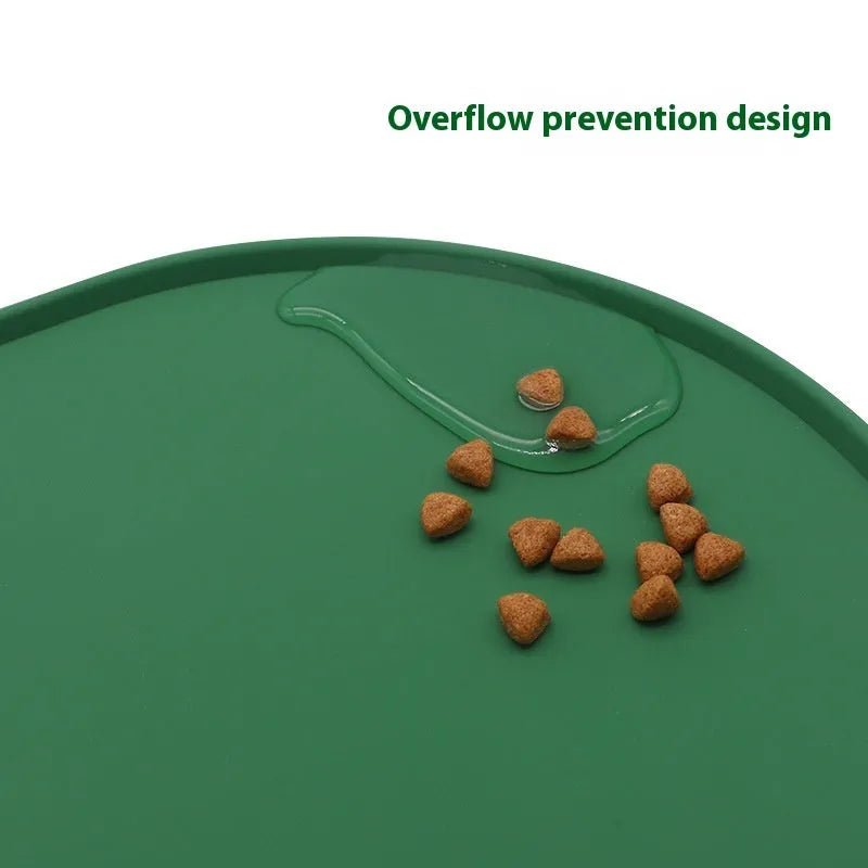 Green silicone waterproof placemat for cat bowls on a wooden floor