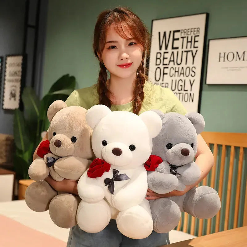 Rose bear plush teddy bear stuffed animal toy in beige, brown or grey colours showing cartoon design