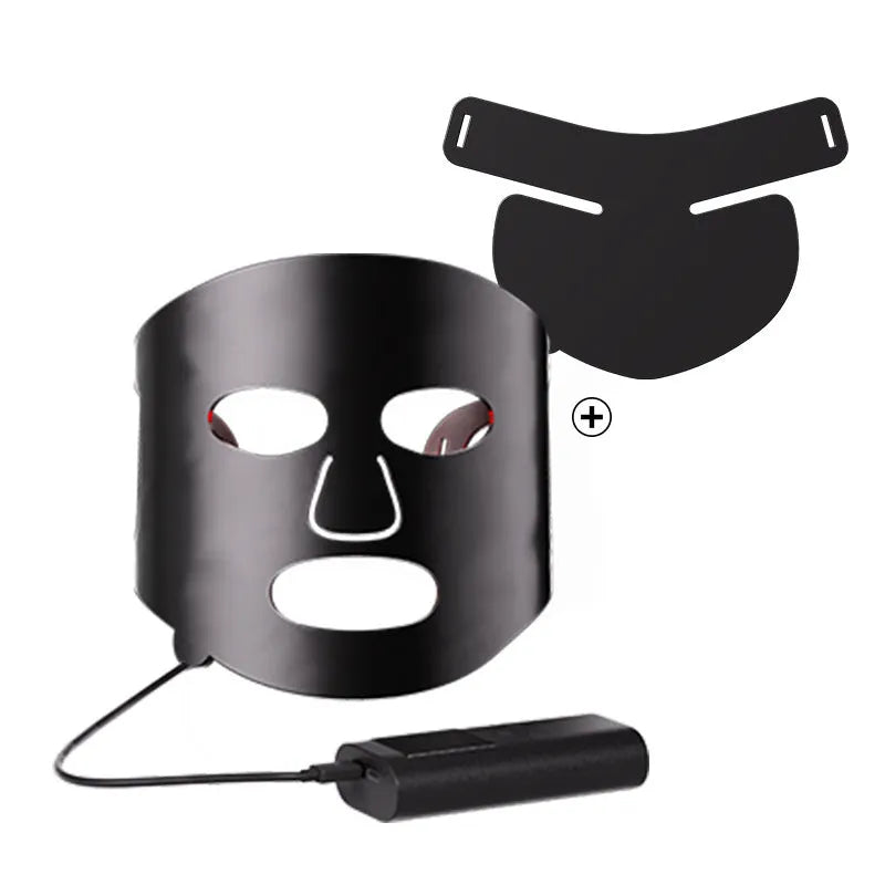 White and black LED phototherapy face mask with adjustable strap and controller for home skin light therapy