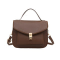 Horizontal square black PU messenger bag with a front sandwich pocket and visible sewing lines.