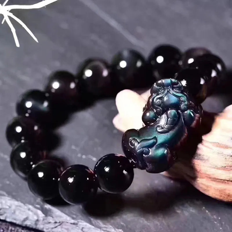 Natural ice colour obsidian crystal bracelet with spherical beads on wrist