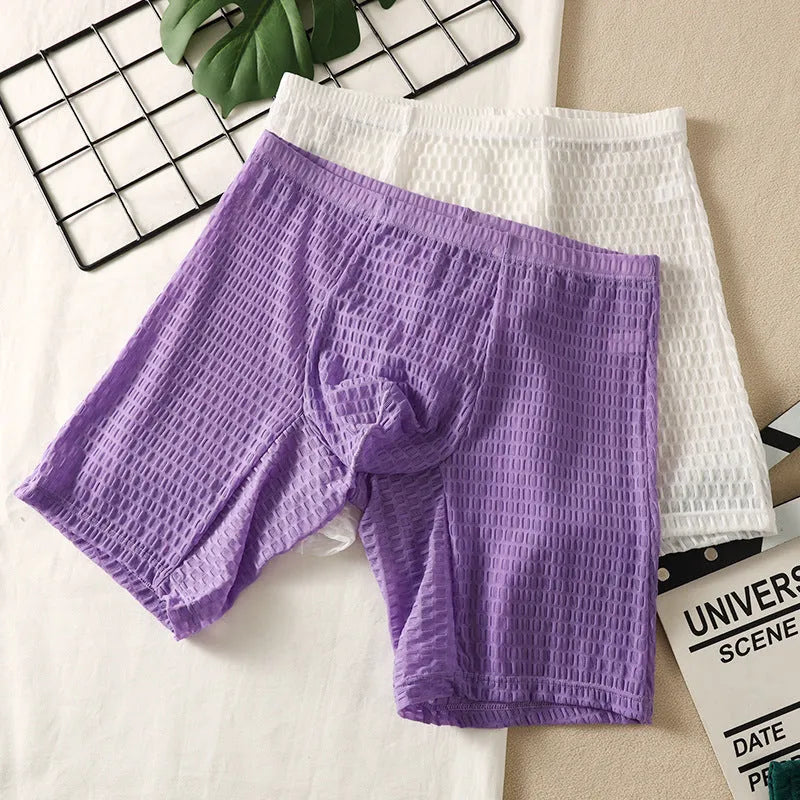 Men's solid colour lace boxer shorts with a hip-lifting fit on a size chart.