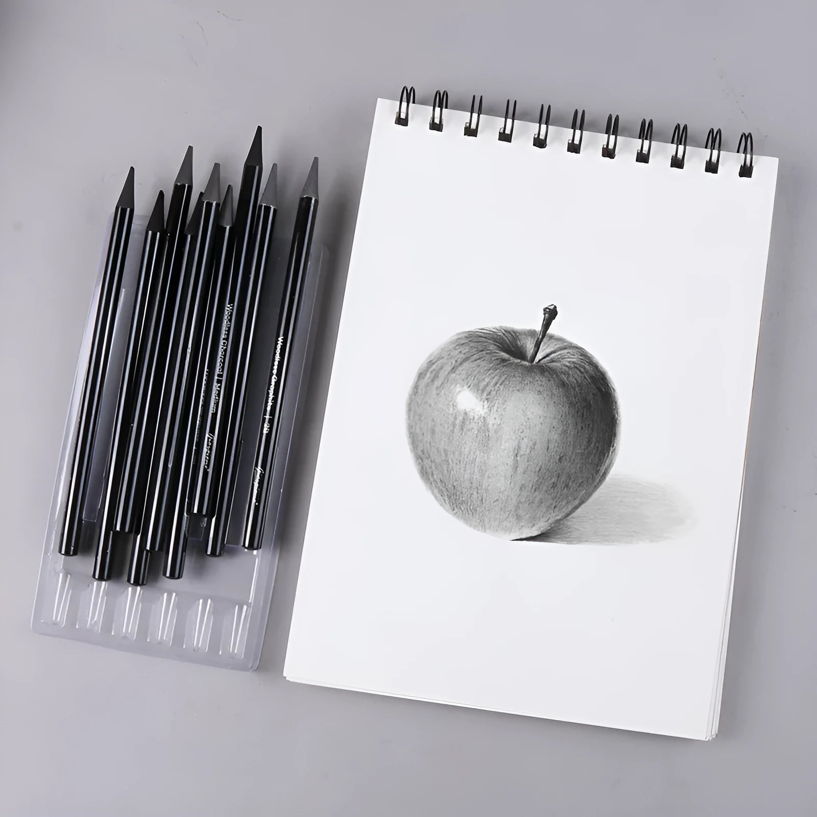 Set of 6 graphite and 3 carbonized drawing pencils on suction card packaging with wooden shell
