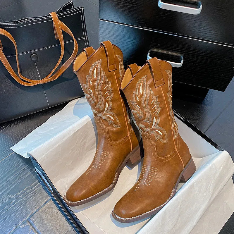 Brown women's mid-calf Martin boots with embroidered pattern and square low heel.