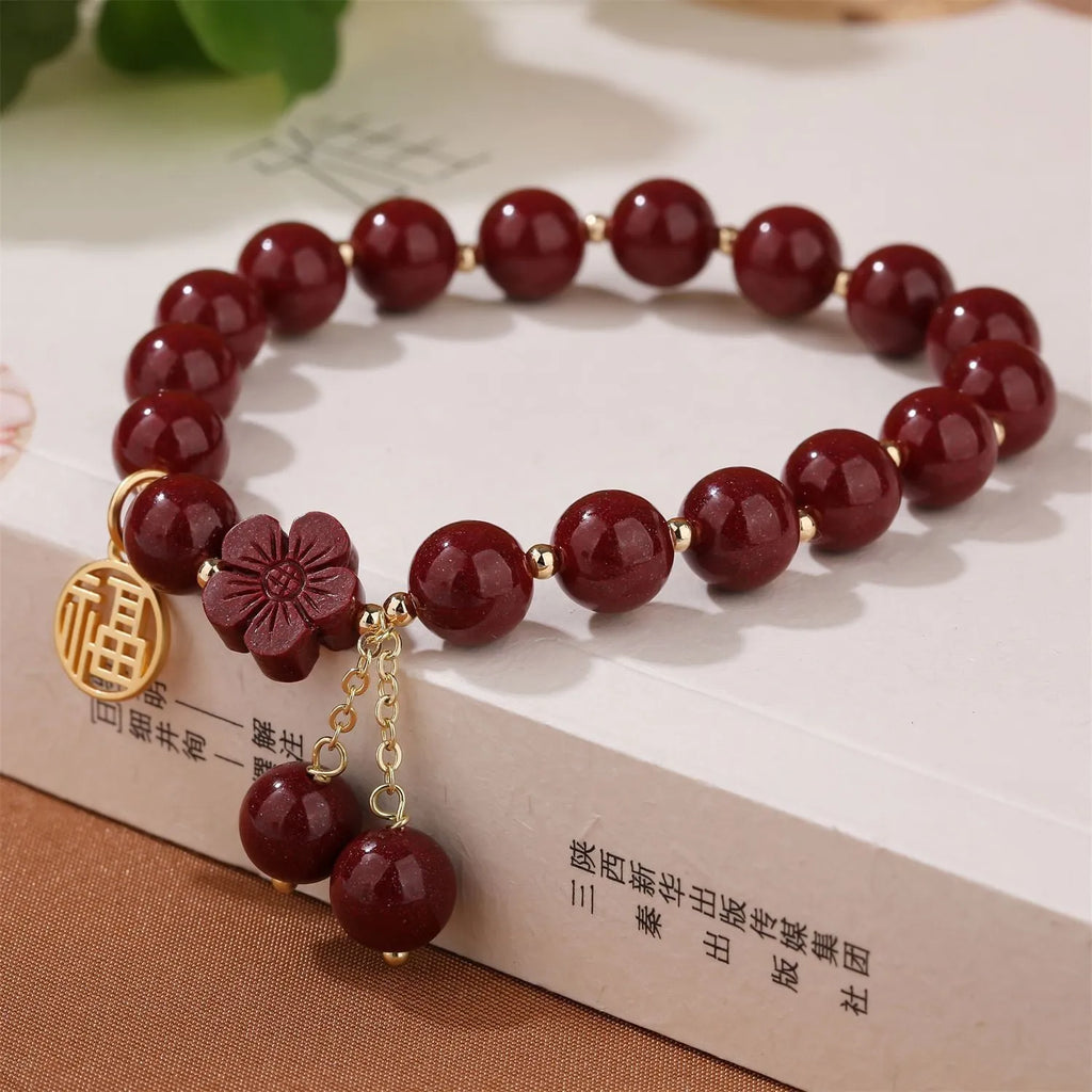 Women's cinnabar bracelet with fu character design and tassel in national style