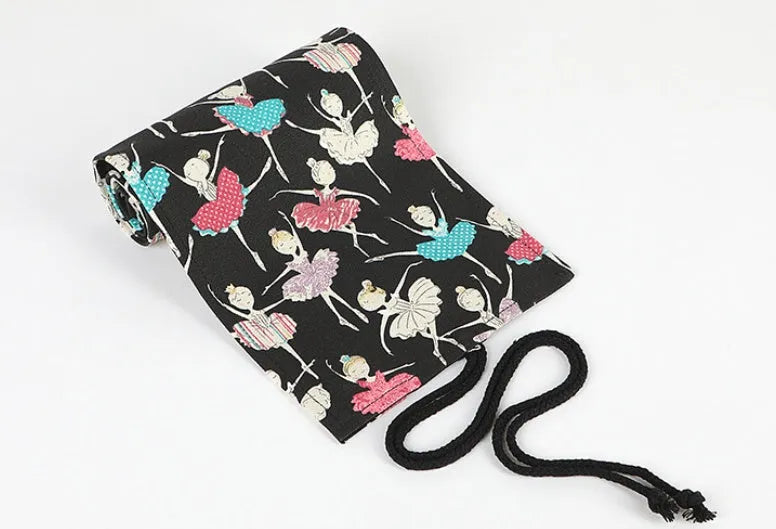 Canvas rolling pencil case with ballet girl print, shown open to display multiple pencil holes.