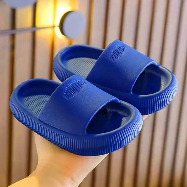 Colourful children's EVA slippers with a thick, textured non-slip sole in various sizes.