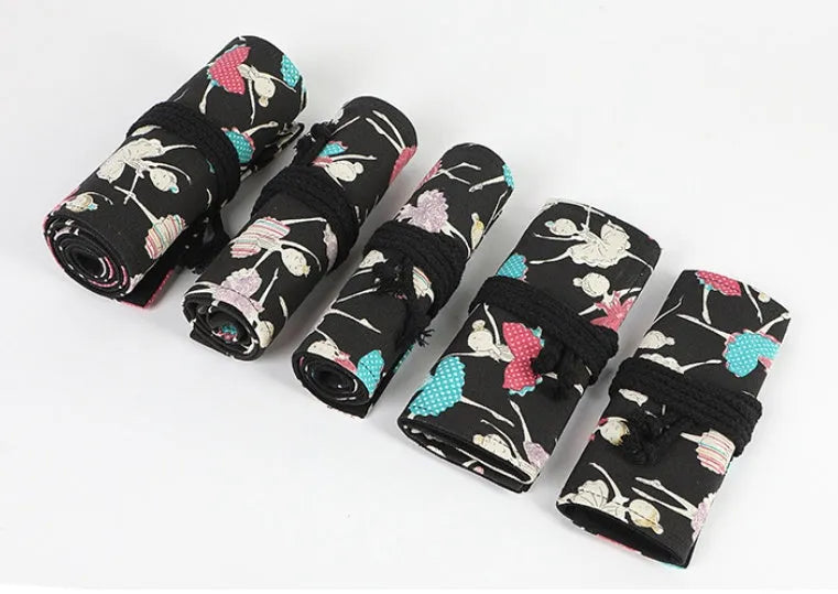 Canvas rolling pencil case with ballet girl print, shown open to display multiple pencil holes.
