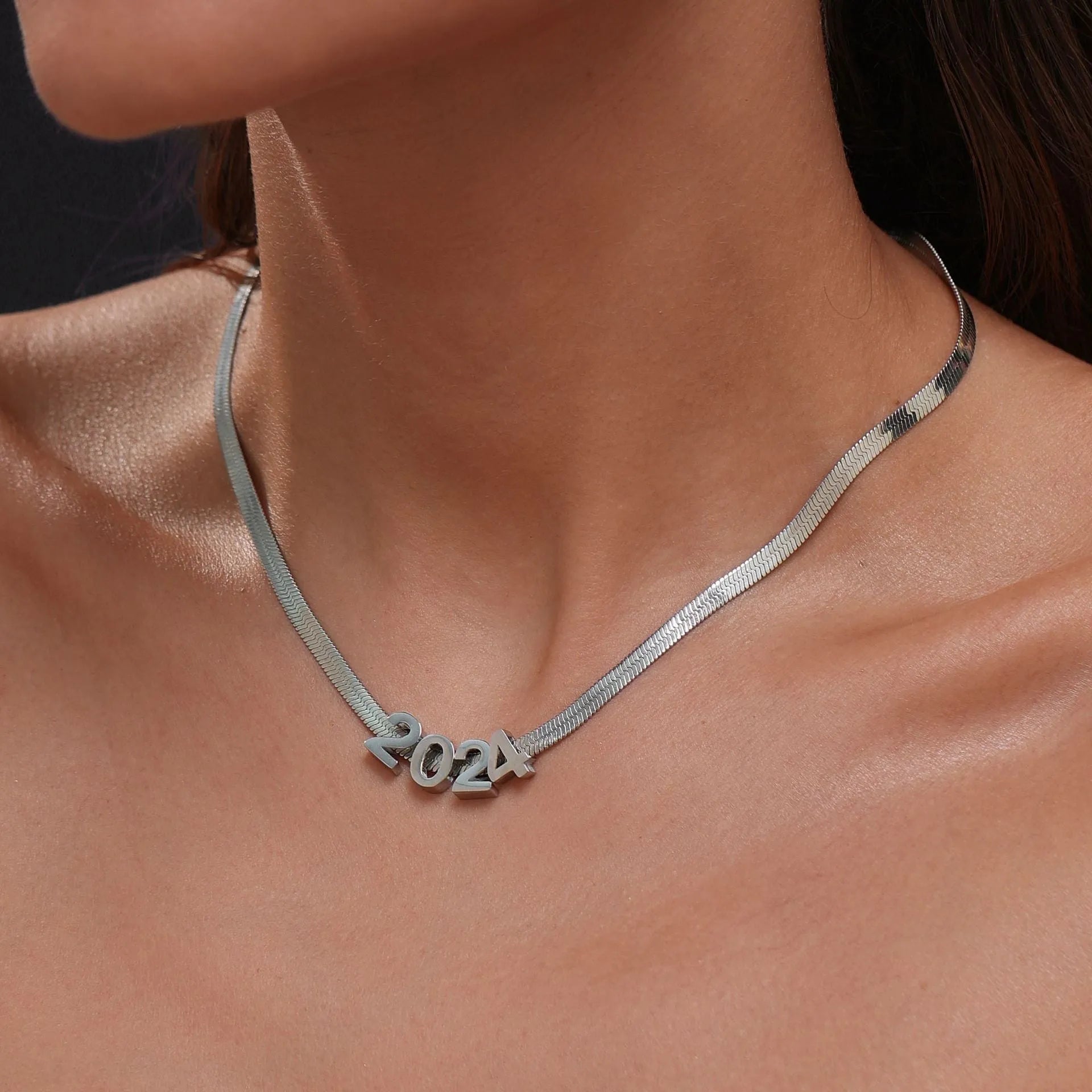 Titanium steel letter necklace with 40.5cm chain in gold electroplated finish showing number pendant
