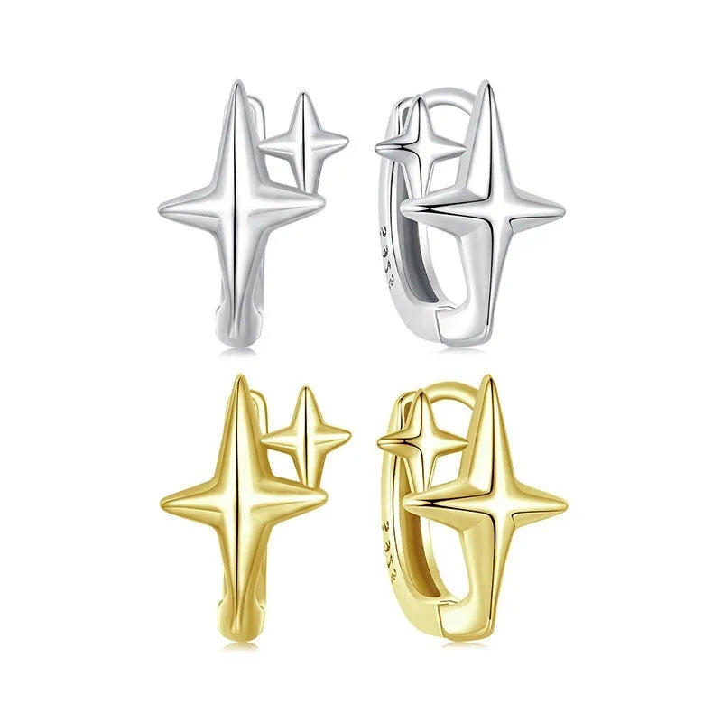 Sterling silver ear clips with minimalist star design and oxidation finish.
