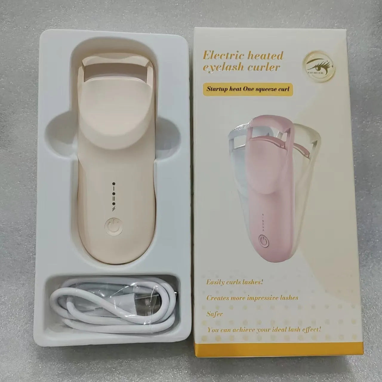 Plastic electric heating eyelash curler with USB cable in cream white, maca pink, or vanilla apricot colour