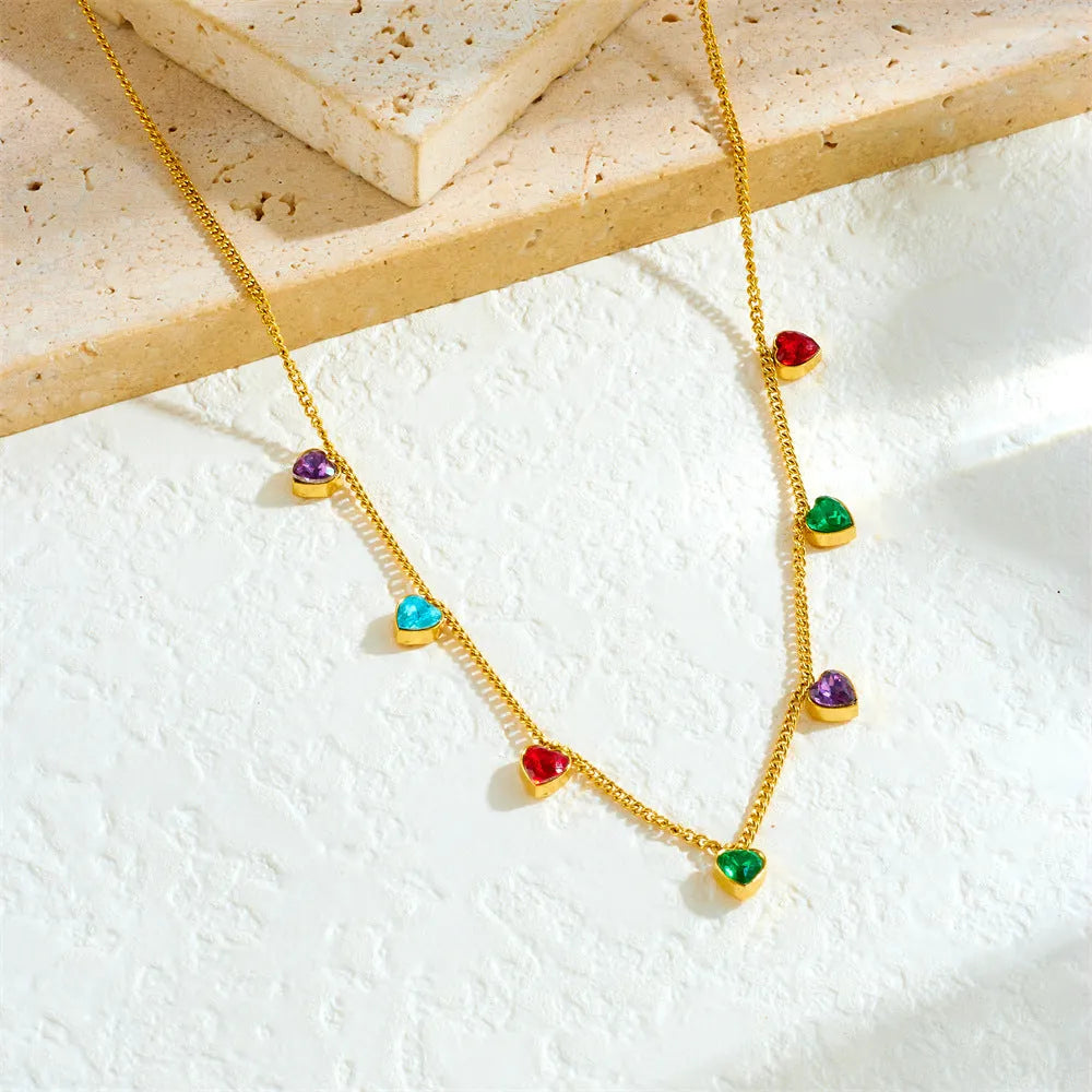 Gold-coloured heart pendant on a stainless steel chain necklace for women.