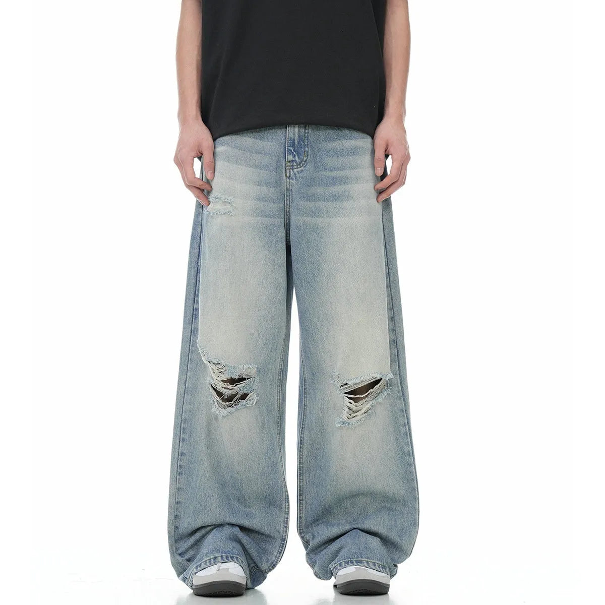 Blue men's straight-leg jeans with ripped distressing detail on the legs.
