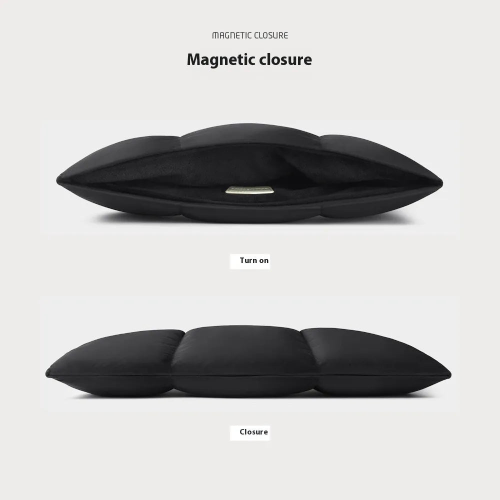 Soft black polyester laptop sleeve for a 15.6-inch laptop on a table.