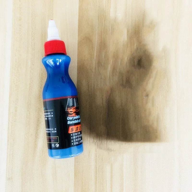 Blue car wiping tool with microfiber applicator and scratch repair agent bottle for automotive paint damage