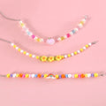 Colourful plastic pearl pet necklace for cats and small dogs in peach, rainbow or flower bead designs