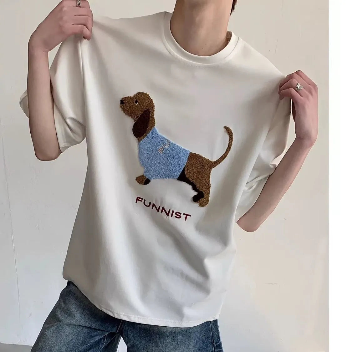 Grey men's cotton t-shirt with a detailed embroidered sausage dog design on the chest.