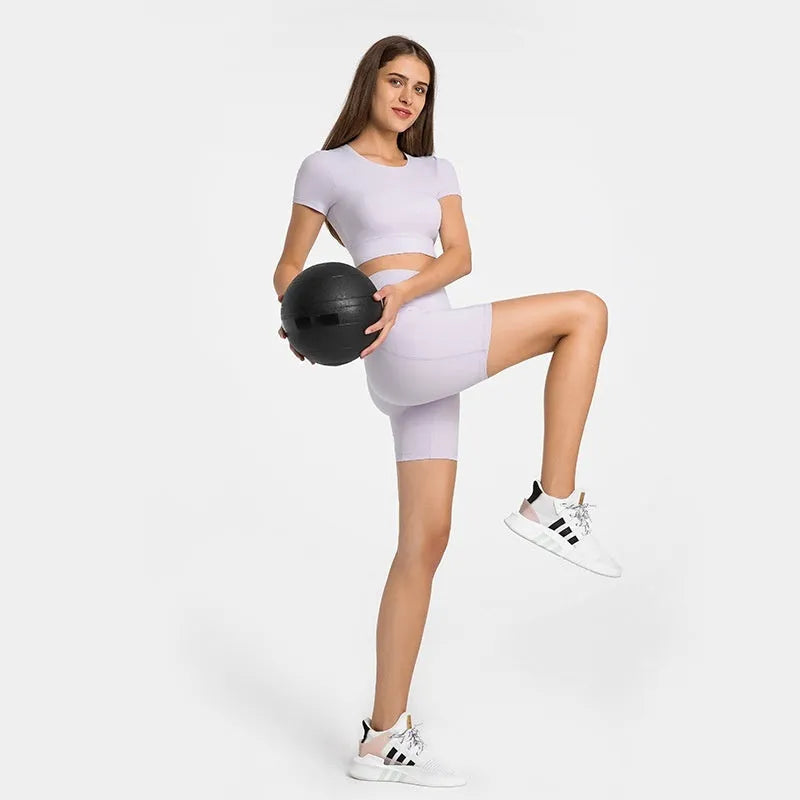 Women's mid-length sports shorts in four colours with super stretch cotton blend fabric for athletic activities