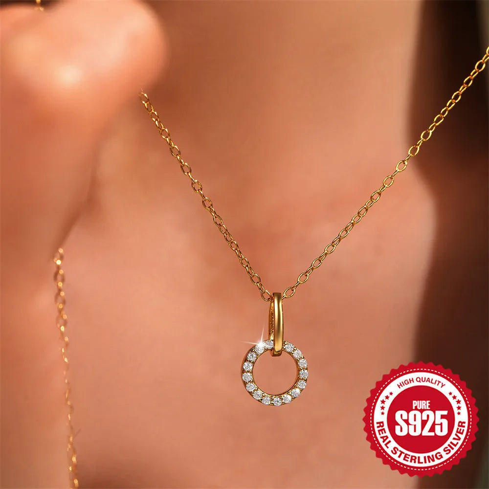Gold colour S925 sterling silver clavicle chain necklace with a round zircon pendant on an adjustable chain.