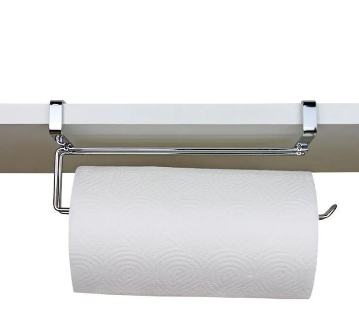Silver stainless steel paper towel holder mounted on a kitchen cabinet door.