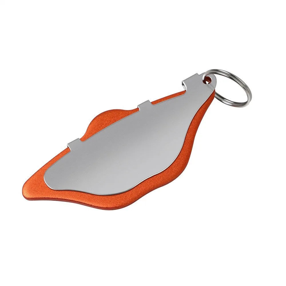 Black and orange metal mountain bike disc brake linings with adjustment flap on a neutral background.